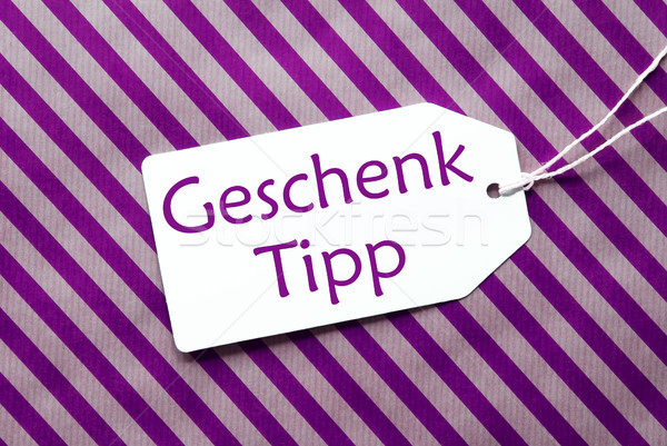 Label On Purple Wrapping Paper, Geschenk Tipp Means Gift Tip Stock photo © Nelosa