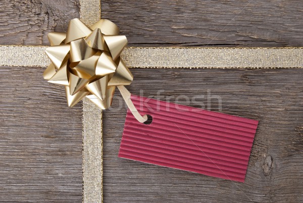 golden bow with red tag with copy space Stock photo © Nelosa