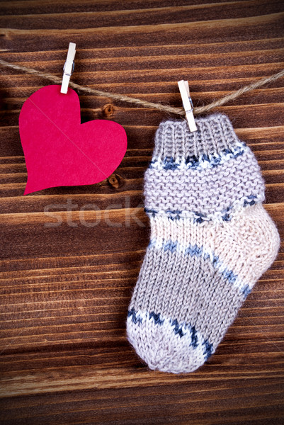Baby Sock with red Heart on Wood Stock photo © Nelosa