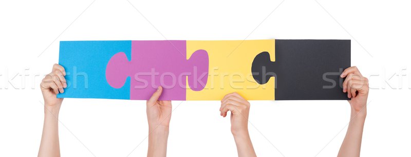 Hands Holding Colorful Pieces of a Puzzle Stock photo © Nelosa
