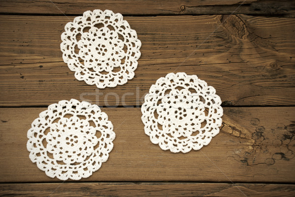 Three White Round Place Mat On Wooden Background Stock photo © Nelosa