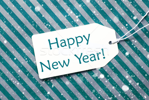 Label On Turquoise Paper, Snowflakes, Text Happy New Year Stock photo © Nelosa