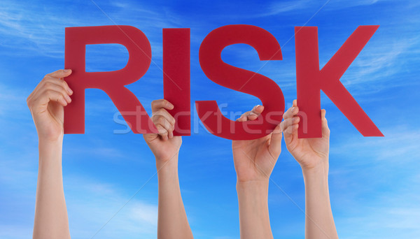 Hands Holding Red Straight Word Risk Blue Sky Stock photo © Nelosa
