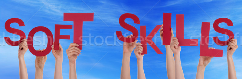 People Hands Holding Red Word Soft Skills Blue Sky Stock photo © Nelosa