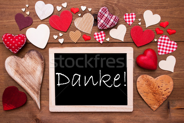 One Chalkbord, Many Red Hearts, Danke Means Thank You Stock photo © Nelosa