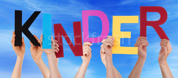 People Holding Colorful Word Kinder Means Kids Blue Sky Stock photo © Nelosa