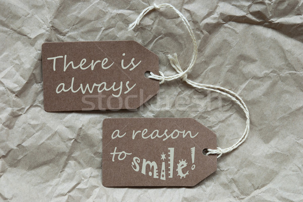 Two Brown Labels With Quote Always Reason Smile Paper Background Stock photo © Nelosa
