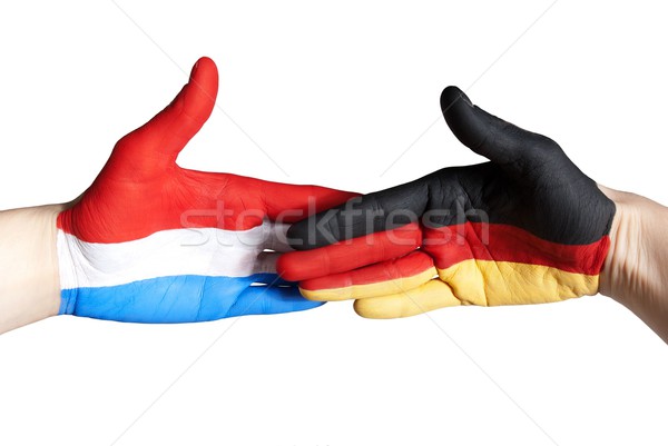 Handdruk Duitsland Nederland geïsoleerd handen vlag Stockfoto © Nelosa