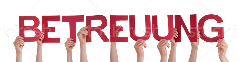 People Holding Straight Word Betreuung Means Care Stock photo © Nelosa