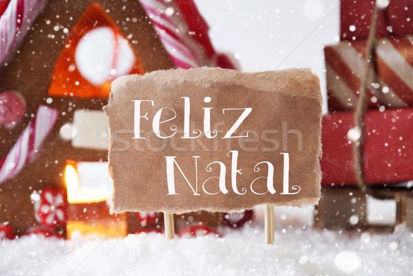Gingerbread House With Sled, Snowflakes, Feliz Natal Means Merry Christmas Stock photo © Nelosa