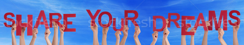 People Hands Holding Red Word Share Your Dreams Blue Sky Stock photo © Nelosa