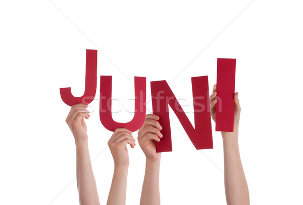 People Holding German Word Juni Means June Stock photo © Nelosa