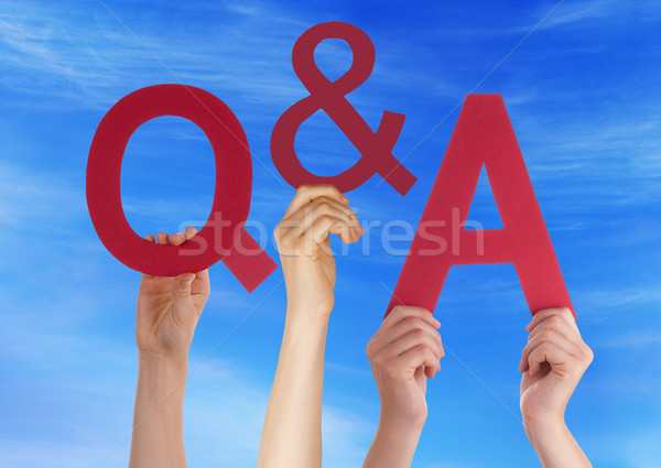 Hands Holding Red Word Questions And Answers Blue Sky Stock photo © Nelosa