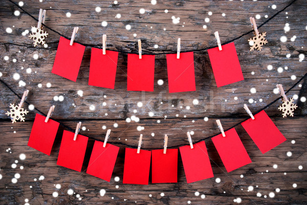 Red Tags with Copy Space Hanging in the Snow on Wooden Background Stock photo © Nelosa