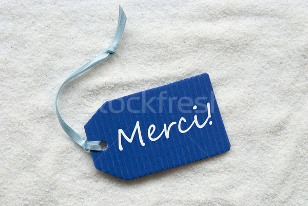 Merci Mean Thank You On Blue Label Sand Background Stock photo © Nelosa