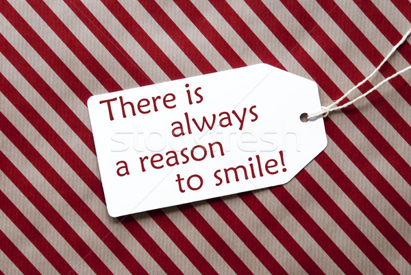 Label On Red Wrapping Paper, Quote Always Reason To Smile Stock photo © Nelosa