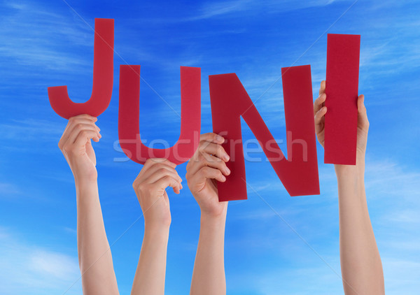 People Hold German Word Juni Means June Blue Sky Stock photo © Nelosa