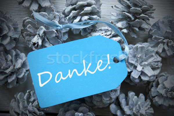 Stock photo: Light Blue Label On Fir Cones Danke Mean Thank You