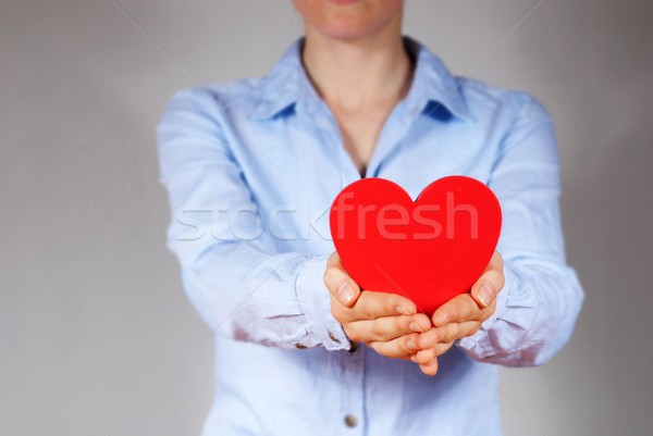 Persona cuore blu shirt mani Foto d'archivio © Nelosa