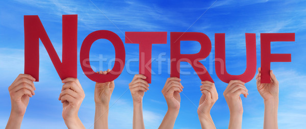 People Holding Straight German Word Notruf Means Emergency Blue  Stock photo © Nelosa