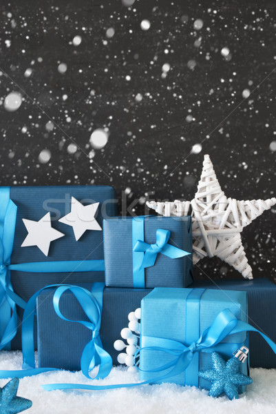 Vertical Blue Christmas Gifts, Black Cement Wall, Snow, Snowflakes Stock photo © Nelosa