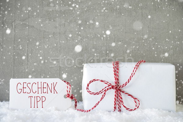 Cement Background With Snowflakes, Geschenk Tipp Means Gift Tip Stock photo © Nelosa