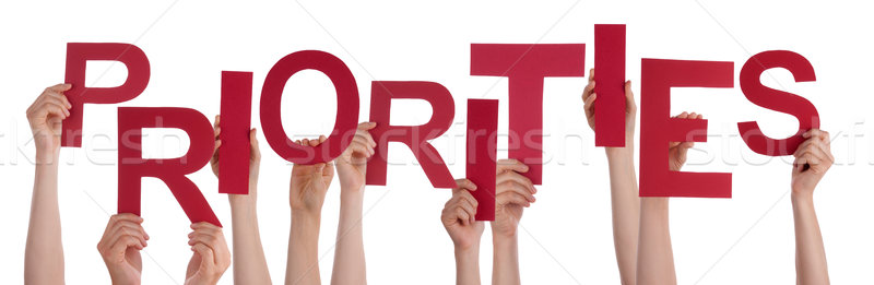Many People Hands Holding Red Word Priorities Stock photo © Nelosa
