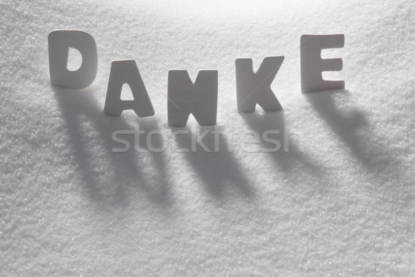 White Word Danke Means Thank You On Snow Stock photo © Nelosa