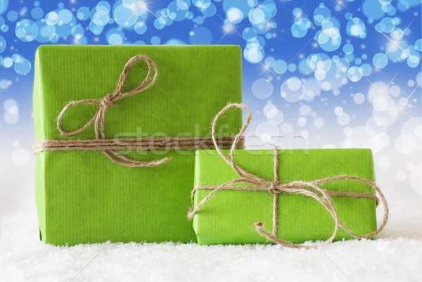 Two Green Gifts On Snow, Blue Bokeh Effect Stock photo © Nelosa