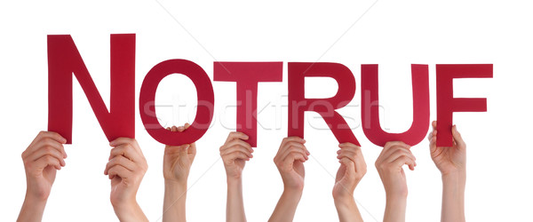 People Holding Straight German Word Notruf Means Emergency  Stock photo © Nelosa