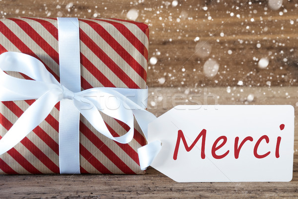 Present With Snowflakes, Text Merci Means Thank You Stock photo © Nelosa
