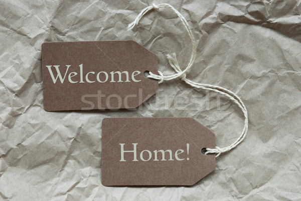 Two Brown Labels With Welcome Home Paper Background Stock photo © Nelosa