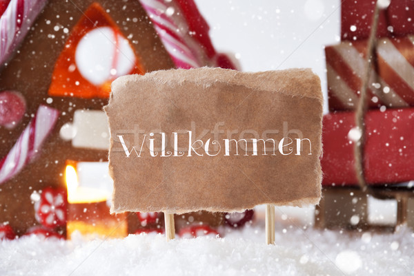 Gingerbread House With Sled, Snowflakes, Willkommen Means Welcom Stock photo © Nelosa