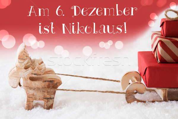 Reindeer With Sled, Red Background, Nikolaus Means Nicholas Day Stock photo © Nelosa
