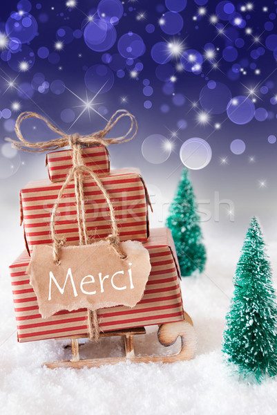 Vertical Christmas Sleigh, Blue Background, Merci Means Thank You Stock photo © Nelosa