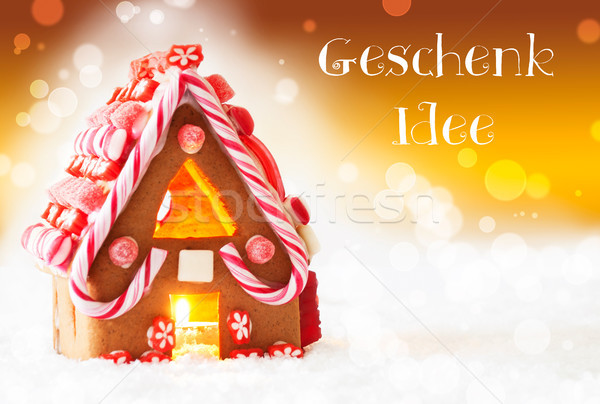 Stock photo: Gingerbread House, Golden Background, Geschenk Idee Means Gift Idea