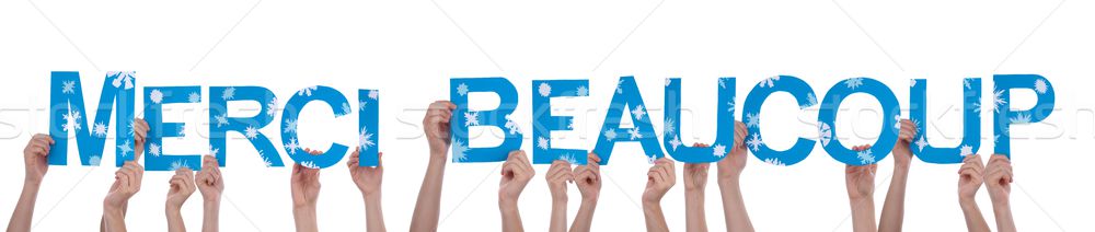 Stock photo: People Holding Merci Beaucoup