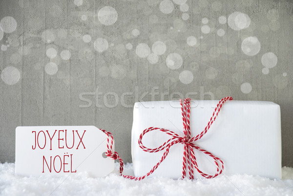 Gift, Cement Background With Bokeh, Joyeux Noel Means Merry Christmas Stock photo © Nelosa