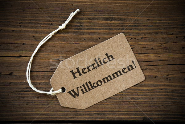 Close Up Of Label With German Text Herzlich Willkommen Stock photo © Nelosa