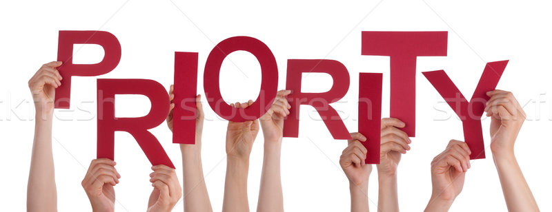 Many People Hands Holding Red Word Priority Stock photo © Nelosa