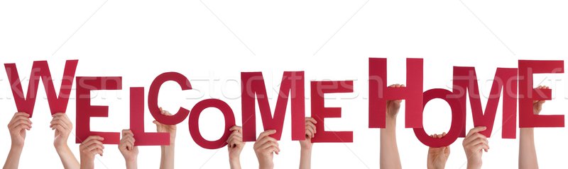 Many Hands Holding a Welcome Home Stock photo © Nelosa