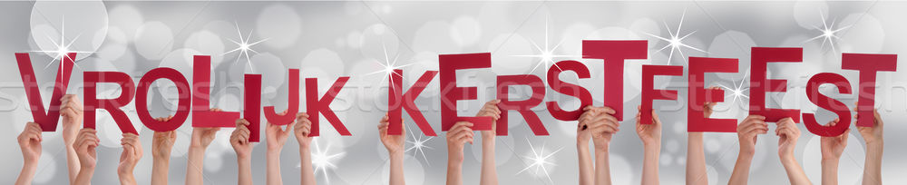 Hands Holding Vrolijk Kerstfeest on Silver Background Stock photo © Nelosa
