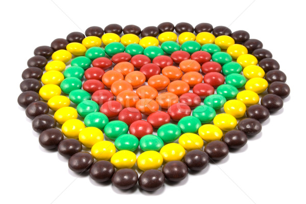 Stock photo: Sweets in multi-coloured chocolate glaze in the form of heart