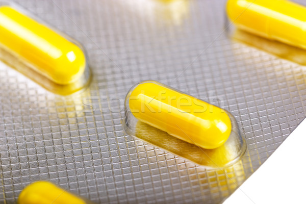 Medicine capsules packed in blisters Stock photo © nemalo