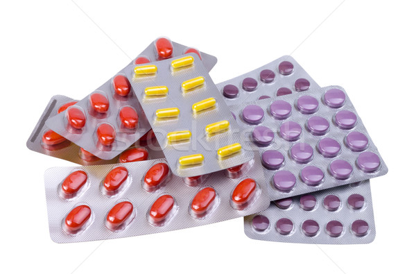 Stock photo: Medicine pills and capsules packed in blisters