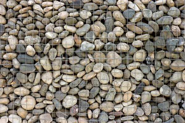 Backgrounds collection - Wall built of sea pebbles Stock photo © nemalo