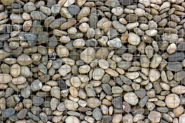 Backgrounds collection - Wall built of sea pebbles Stock photo © nemalo