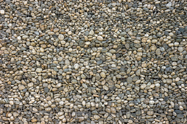 Backgrounds collection - Wall built of sea pebbles Stock photo © nemalo