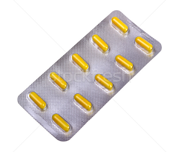 Medicine capsules packed in blisters Stock photo © nemalo