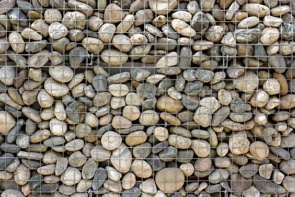Backgrounds collection - Wall built of sea pebbles Stock photo © nemalo